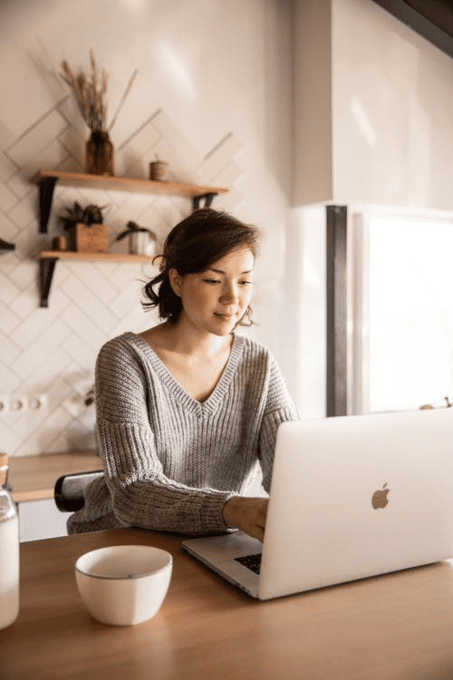 A woman searching online for the best PCO car in London