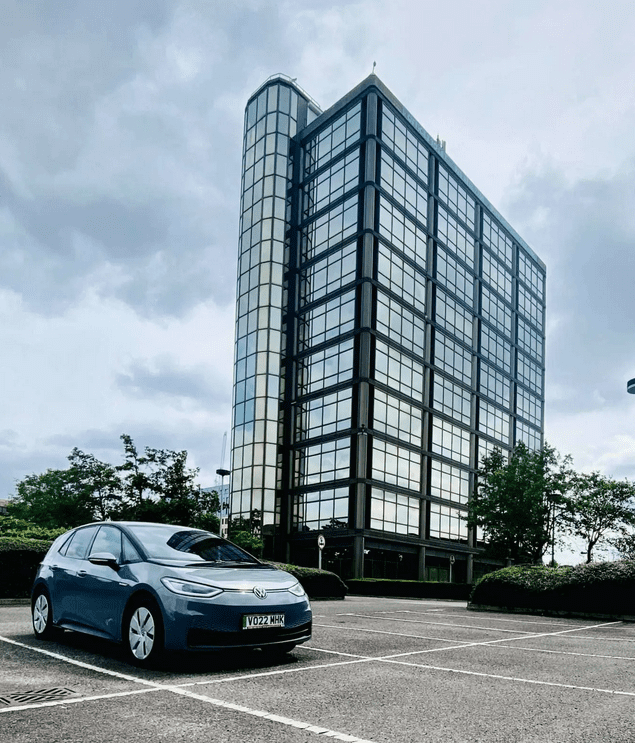 A Volkswagen ID 3 in a parking lot.