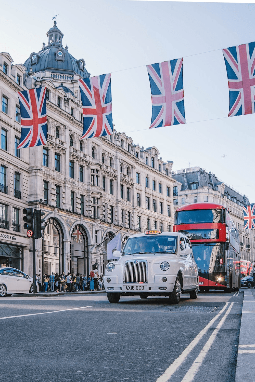 a taxi and a bus on Oxford Street in London