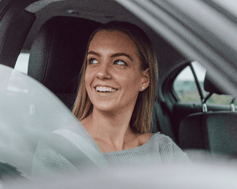 A woman driving a car.