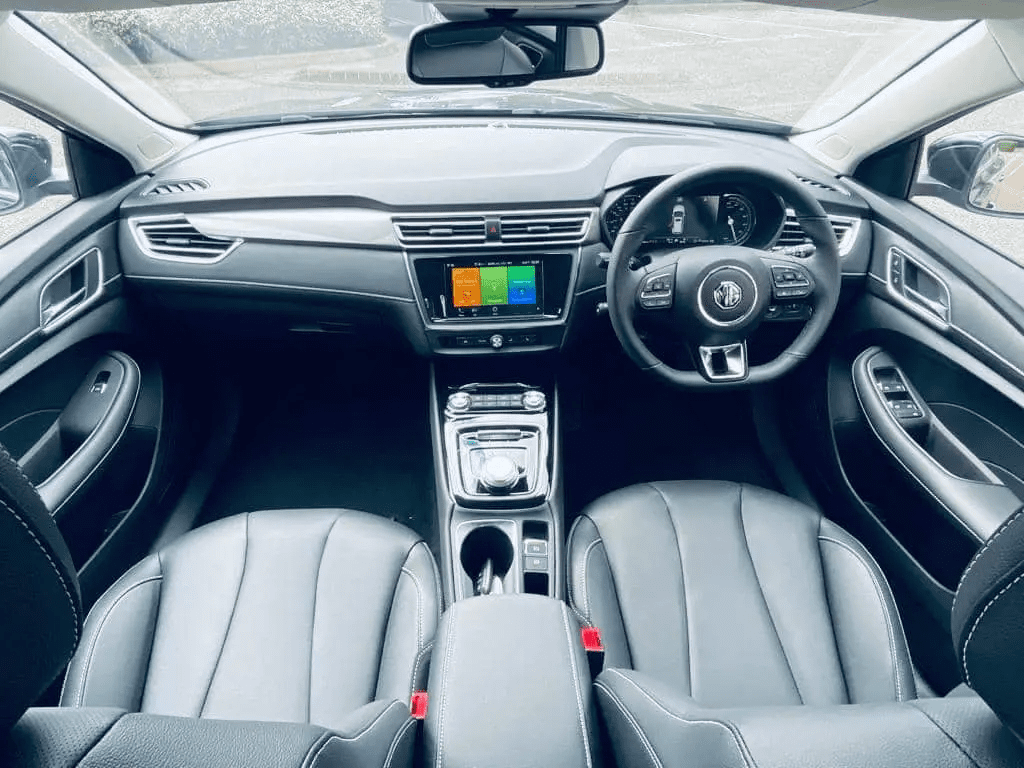 the interior of an MG5 PCO car for hire in London with a touchscreen and gearbox in the centre