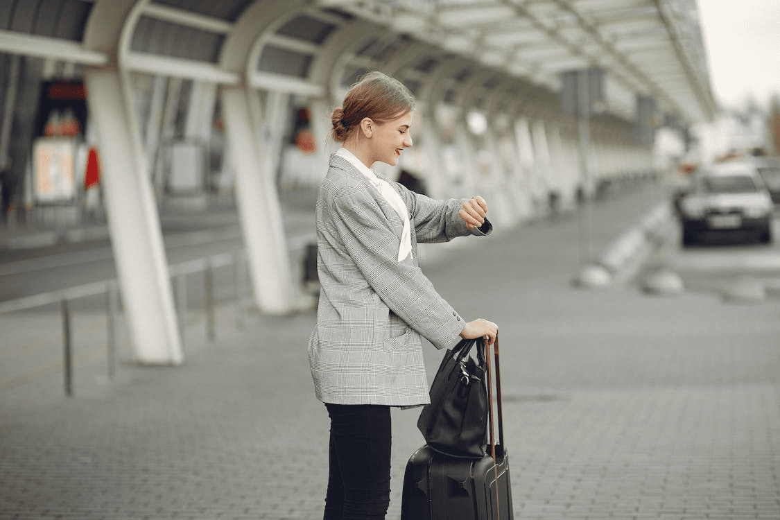 Passenger at the airport terminal waiting for Uber 