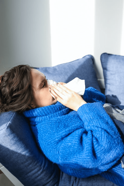 A person experiencing symptoms of a cold