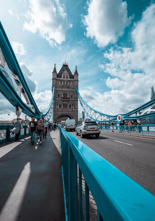 Pedestrians and cars on a road in London