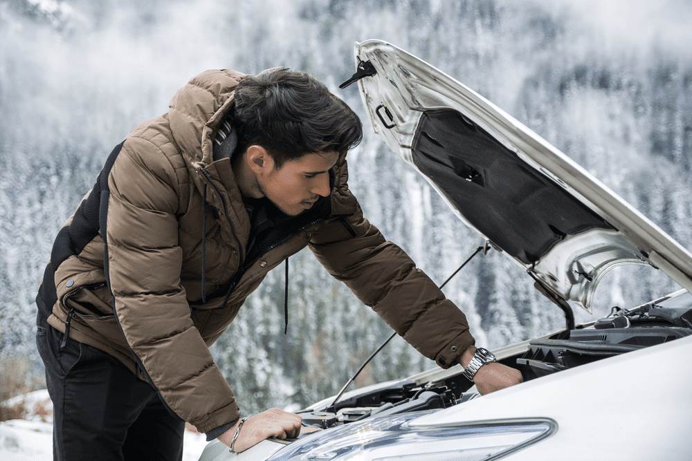 A person is performing car inspection