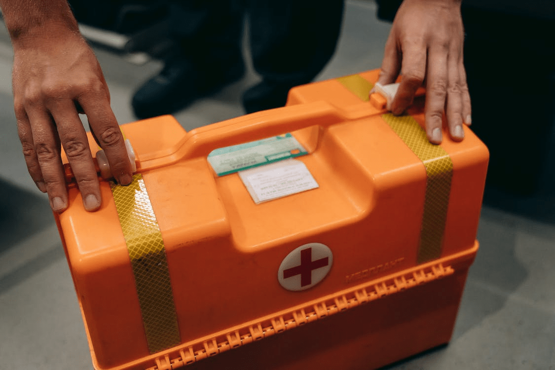 PCO driver holding a first aid kit