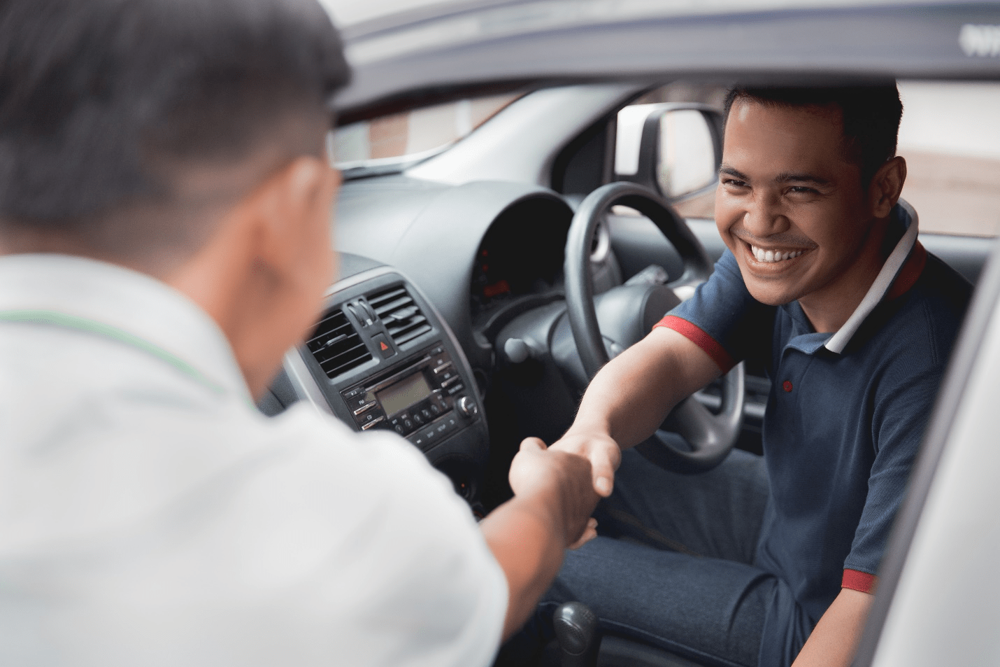 A PCO driver greeting passenger